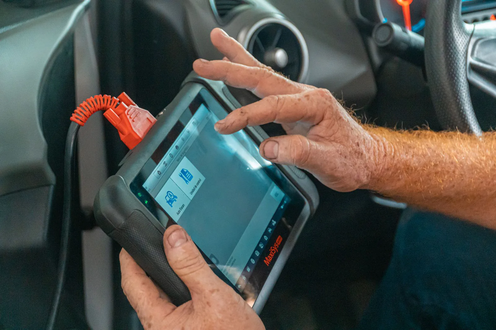 Diagnostic scan tool connected to a vehicle