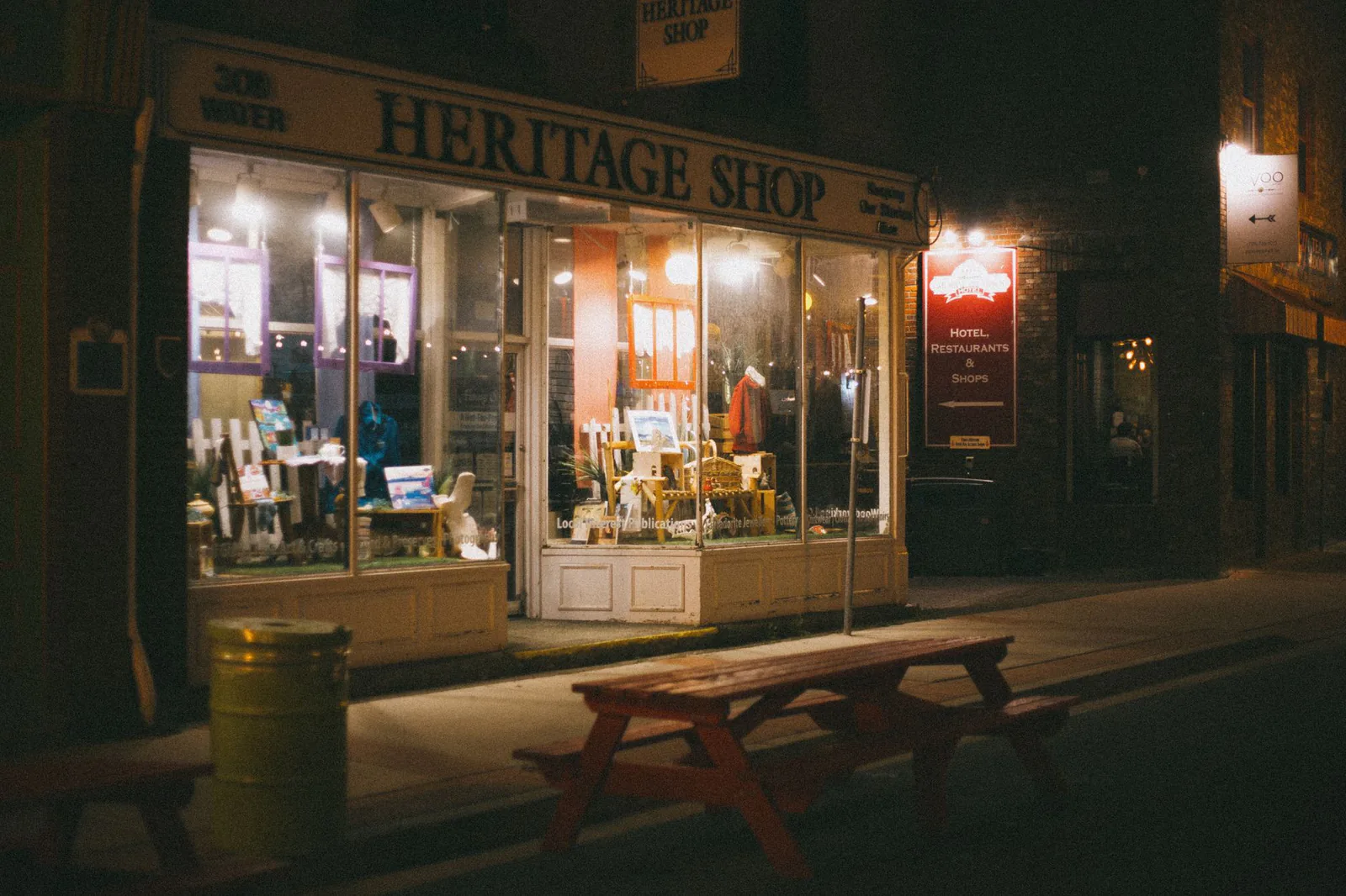 Illuminated storefront on a Bishop Arts evening