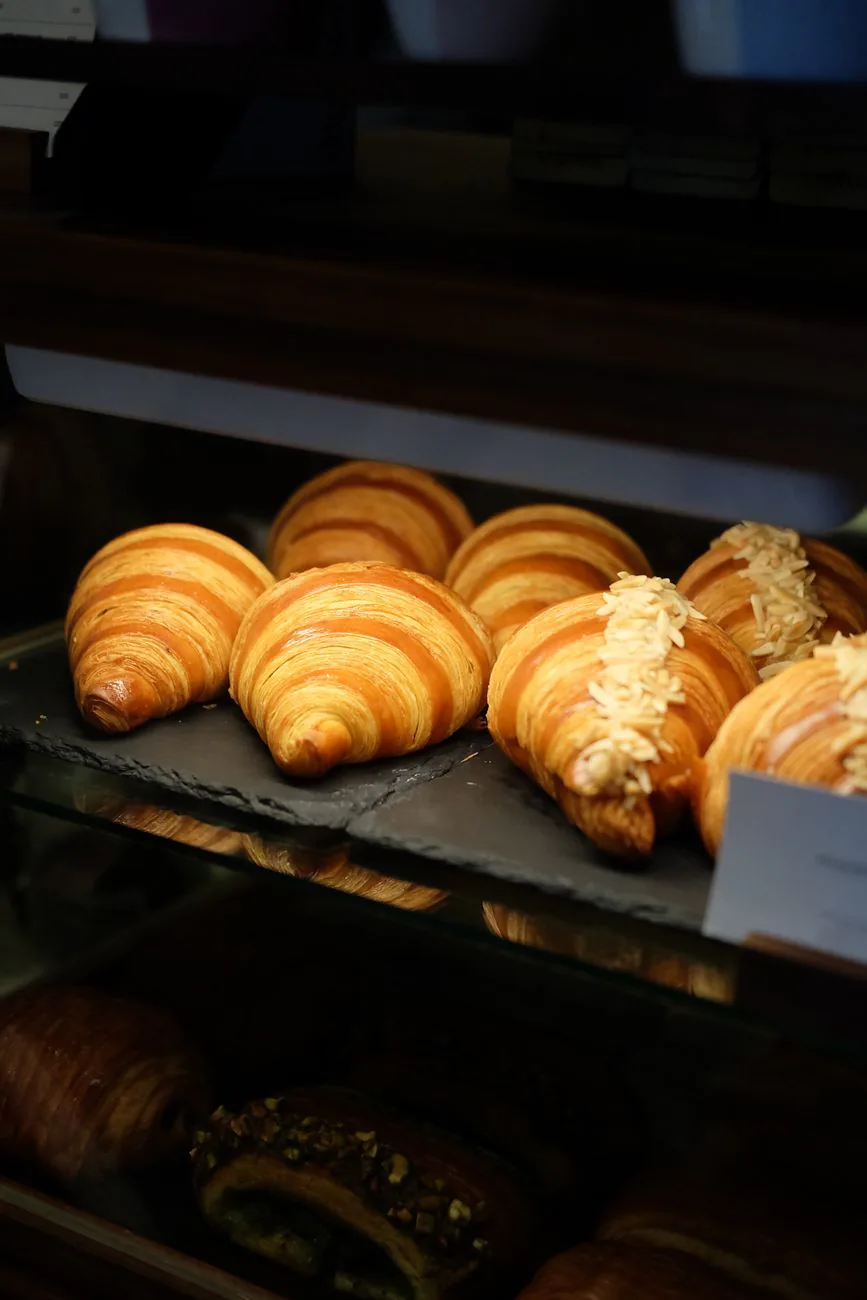 Golden croissants at the pastry counter