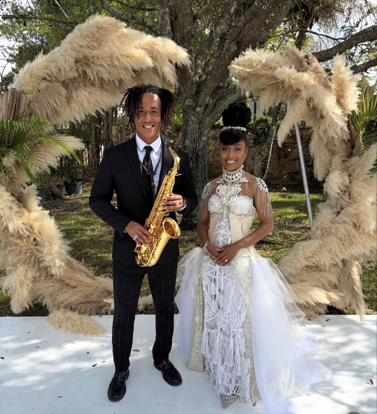 Saxophonist performing beside a bride at a wedding ceremony