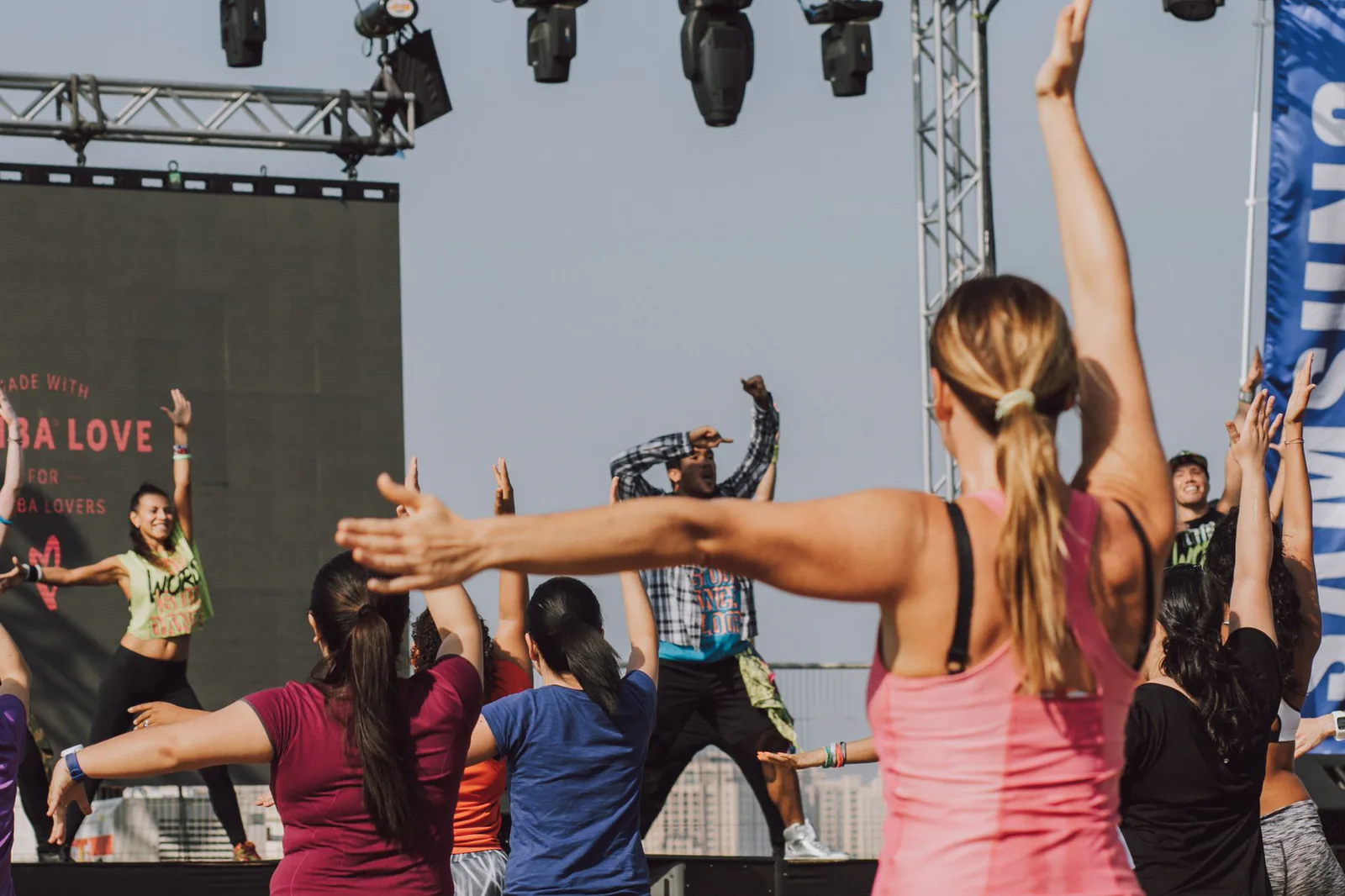 An energetic outdoor Zumba session led by an instructor