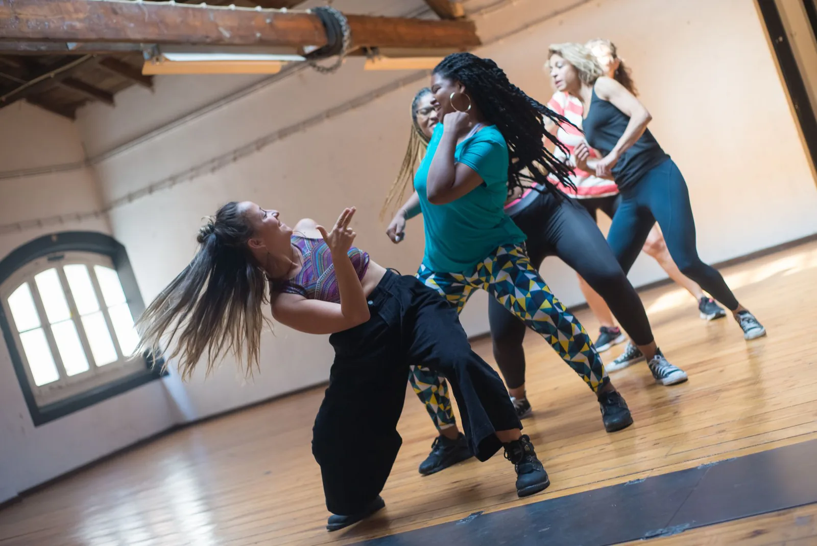 A lively dance class in a bright studio