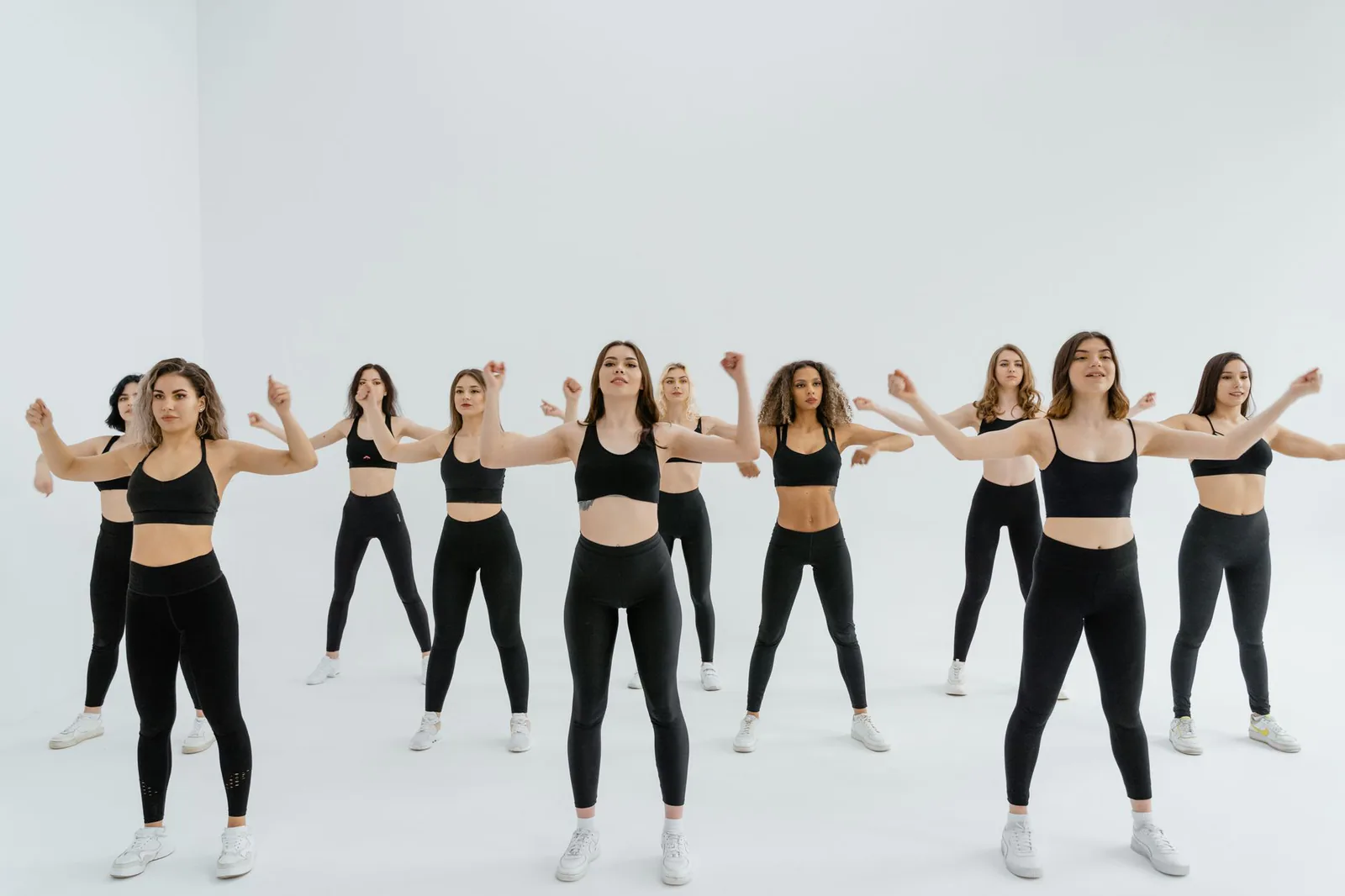 An energetic group performing a dance fitness routine
